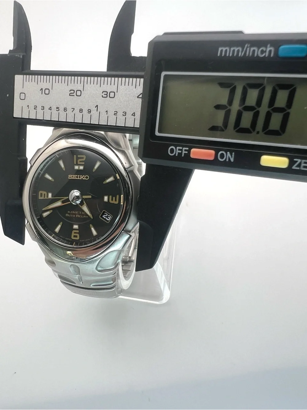 Seiko Kinetic Auto Relay Black Dial Stainless Steel Watch with Gold Accents